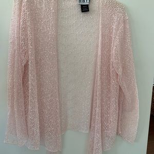 Cover up light knit with some sparkle for summer evenings